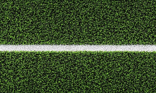 Close up of green artificial turf with white line on sports field.