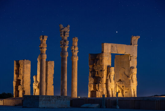 Majestic Gate of All Nations in the ancient city of Persepolis illuminated at night under a starry sky, Shiraz, Iran