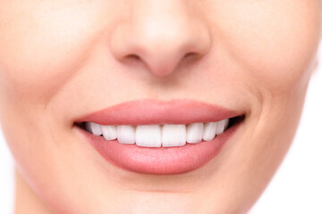 Fototapeta premium Smiling human face close-up, showing perfect teeth