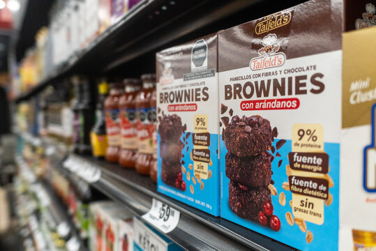 Villa de Alvarez, Colima. Mexico. May 15, 2026: Packaged Delicious Cranberry Chocolate Brownies Arranged on a Supermarket Shelf Display
