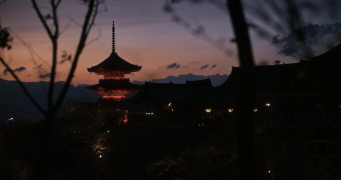 Wide silhouette shot of old kiyomizu-dera Japanese temple over city