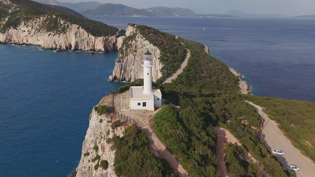 Aerial Drone Pullback from Cape Lefkatas Lighthouse on Dramatic Cliffs, Lefkada Greece