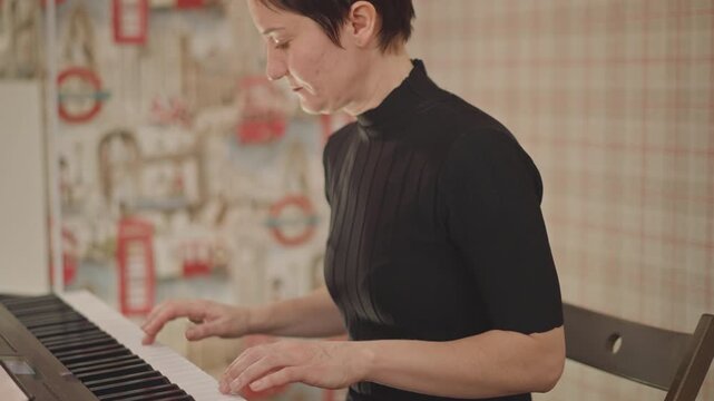 Female musician playing electronic keyboard, cozy classroom setting, focused on sheet music and hands moving across keys, demonstrating technique and posture, coaching through tempo and dynamics, warm