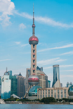 Shanghai, China - SEPTEMBER 12, 2025: The iconic Oriental Pearl Tower and surrounding skyscrapers in Shanghai Lujiazui financial district under a clear blue sky