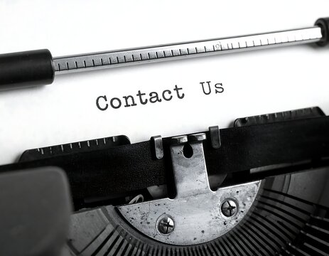 Contact us button on vintage computer keyboard.