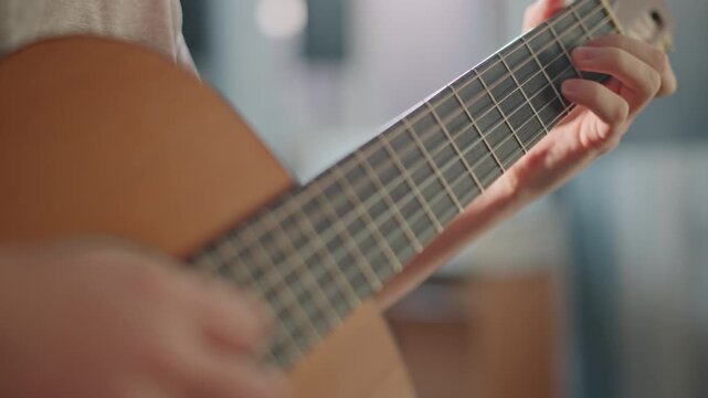 Closeup fingerstyle guitar, expressive fretting motion solo guitarist rehearsing advanced passages in home studio, cinematic backlight, tight focus on fingertips, nuanced dynamics, emotional