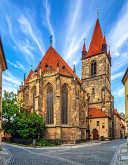 Fototapeta premium Historic gothic cathedral with tall spires and intricate stonework.