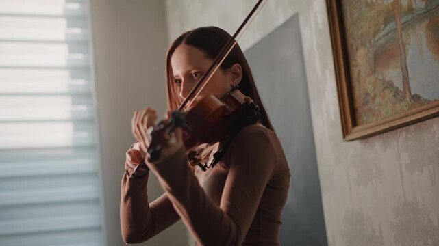 White woman demonstrating violin technique closeup, studio light and window backdrop, detailed bowing and finger placement, coach guiding posture and intonation, focused professional practice