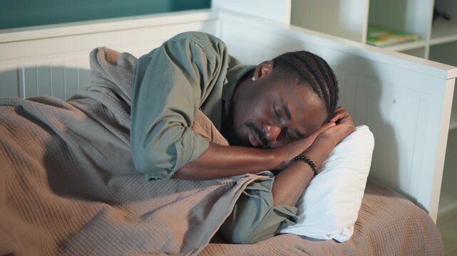 Sleeping patient resting in home bed, soft blanket and pillow under head, dim bedside lamp, braided hair, quiet nighttime atmosphere, recovering after emergency assessment with paramedic support, calm