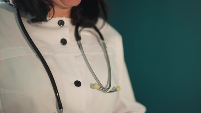 Doctor ready consultation. Medical professional getting prepared for telehealth session. Doctor ensures equipment readiness and maintains professional demeanor prior to online medical review