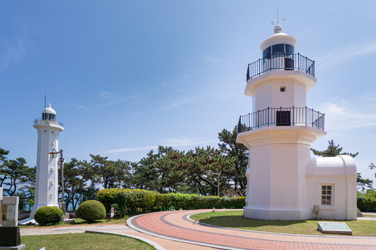 Ulsan, South Korea, April 18, 2026: Ulgi Lighthouse at Ulsan Daewangam Park with a Forest Trail Leading to Coastal Red Rock Formations, Iron Bridge, Observation Tower  울산 대왕암 울기등대 공원

