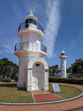 Ulsan, South Korea, April 18, 2026: Ulgi Lighthouse at Ulsan Daewangam Park with a Forest Trail Leading to Coastal Red Rock Formations, Iron Bridge, Observation Tower  울산 대왕암 울기등대 공원

