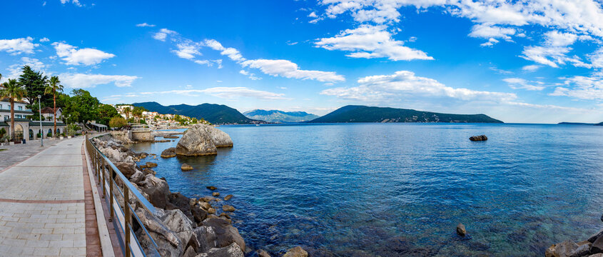 Breathtaking panoramic vista of the vibrant Herceg Novi waterfront promenade and the sweeping waters of the Kotor Bay