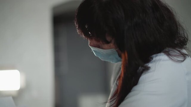 Caucasian nurse handling testing materials. Healthcare professional setting up diagnostic testing tools. Caucasian healthcare provider methodically preparing testing supplies in community environment