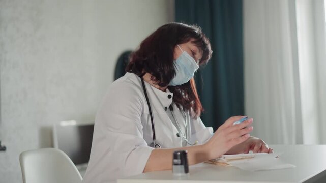 Healthcare professional busy. Clarity and focus during remote medical consultation session. Healthcare worker diligently documenting details on digital forms during online diagnosis session