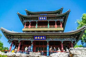 Fototapeta premium Taiyun, China - May 7 2026: Historic pavilion façade of Jinci, showcasing elegant timber architecture, intricate Dougong brackets, and the enduring beauty of traditional Chinese temple design