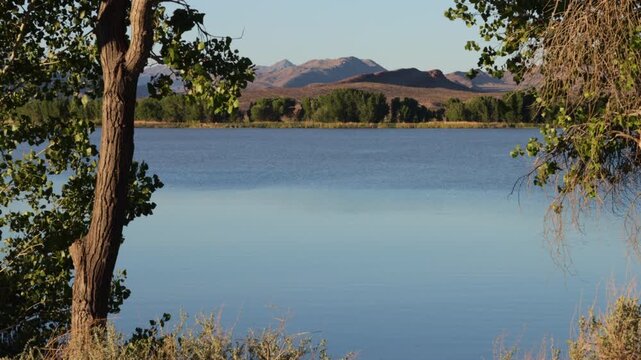 Dawn light on the lake and distant mountains at Pahranagat National Wildlife Refuge in Nevada