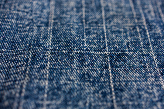 Selective focus blue denim texture with woven textile pattern background