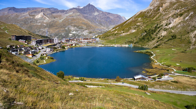 Tignes ski resort and blue lake Lac de Tignes during summer, Savoie, Auvergne-Rhone-Alpes, France, Europe.