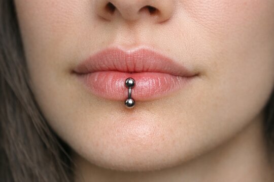 Close-up shot of a person's face with a nose piercing, suitable for beauty or lifestyle photography