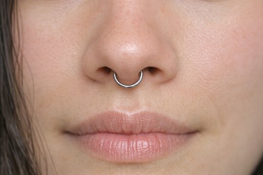 A close-up shot of a person wearing a nose ring, great for portraits and fashion photography