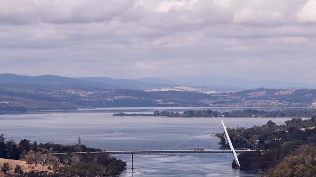 Sky to Batman bridge across Tamar river in Tasmania wine making agriculture region.