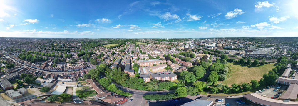 Aerial Ultra Wide Panoramic View of Residential District of Luton City During Clear Blue Sky. Drone Flight Above Urban City Streets of British City and Town of England Great Britain. 