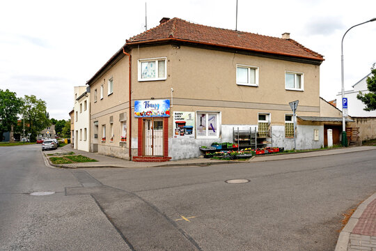 obec Vrbatky, Czech Republic - May 3, 2026: Corner shop and residential building on quiet street in village obchod na rohu ve vesnici