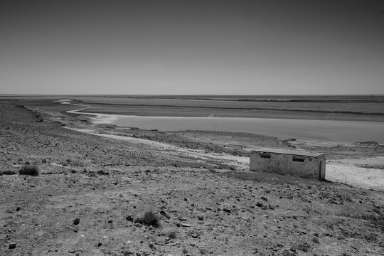 Amudarja or Amu Darya River, the Border between Uzbekistan and Turkmenistan with a Dilapidated Building Black and White