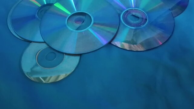 Cd, DVD, CD, DVD, Compact disc on a blue background, closeup of photo taken in malaysia