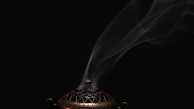 Incense sticks with white texture smoke on black background with copy space