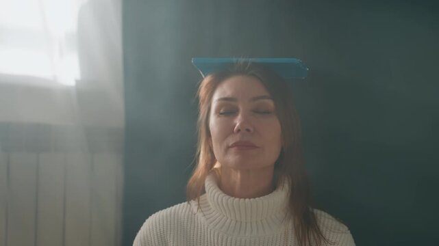 Older caucasian woman balancing book on head in sunlit living room, knitted sweater, eyes closed, practicing posture and breathing for grammar and diction coaching, calm mindful routine, soft window