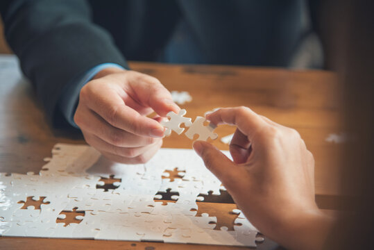 Unified synergy assembly business game implementation multiple puzzle meeting. Business connections strategy synergy team solution. Implement puzzle improve communication solve synergy organize team