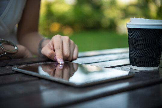 Woman hands holding mobile phone outdoor surfing internet online technology lifestyle. Woman hands writing on Agenda. Technology lifestyle. Smart Business woman note and schedule to set timetable