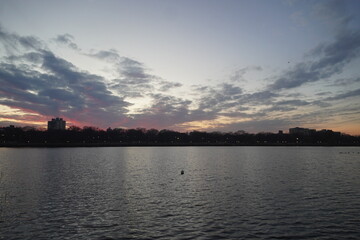 Fototapeta premium Sunset Lake Landscape with Clouds