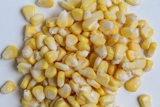 Fresh sweet corn kernels on white background