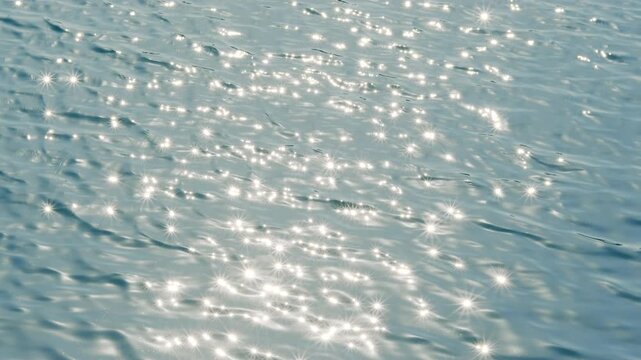 Sparkling summer sea surface with sunlight reflection and refreshing ocean concept