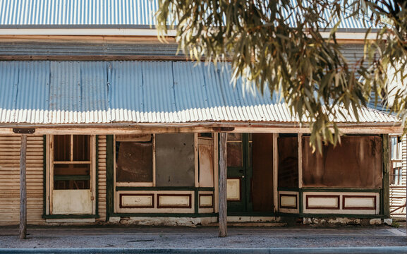 Old rustic shop fronts on a country street.