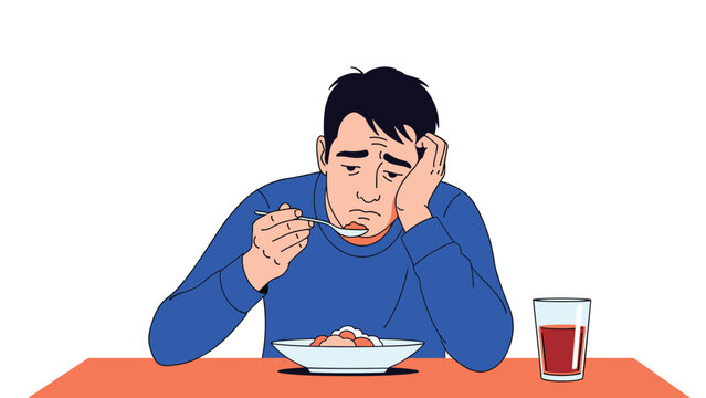 Sad and lonely man sitting at a dining table while listlessly eating his meal and looking very disappointed.
