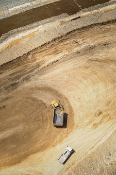 Earth moving equipment doing earth work on industrial construction site, Curtis Island, Queensland