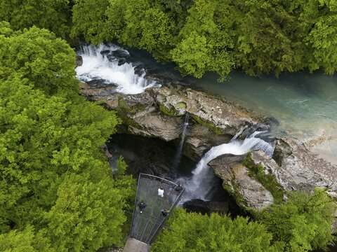 View over a waterfall in a tree-lined river, with a platform, aerial view, Martvili Gorge, Martvili Canyon, village of Inchchuri, Abasha River, Martvili Municipality, Mingrelia-Upper Svaneti Region, Georgia