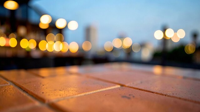 Dusk illumination of porous orange tile surface with warm golden restaurant bokeh