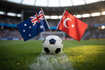 Fototapeta premium The national flags of Australia and Turkey proudly display next to a soccer ball on a lush stadium field