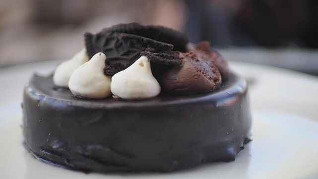 Delicious chocolate cake with toppings served at a cafe