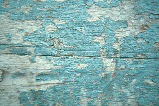 Old blue wood texture with peeling paint. Background and texture for design.