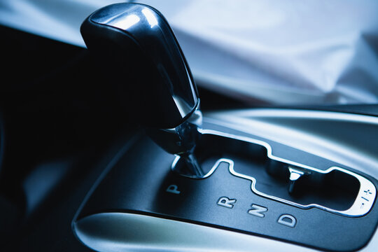 Close up of automatic gear shift in modern car. Selective focus.