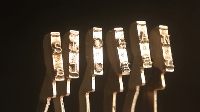 The word Slogan with vintage typewriter hammers 