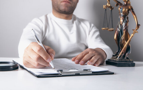 Lawyer, attorney or notary working with contract papers. Law concept.