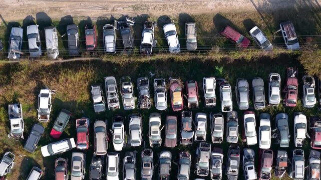 Aerial top down view of car junkyard and scrap metal yard