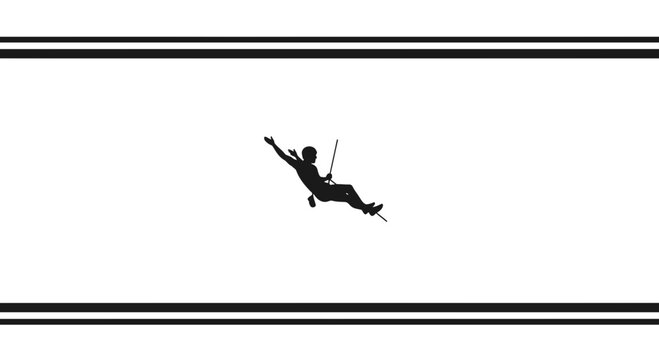 Silhouette of a rock climber rappelling down a cliff face, extreme sports adventure